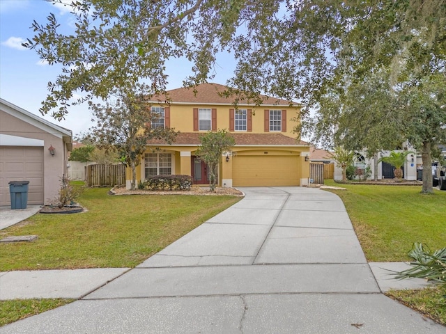 view of front of home with a front yard and a garage