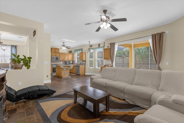 living room featuring ceiling fan