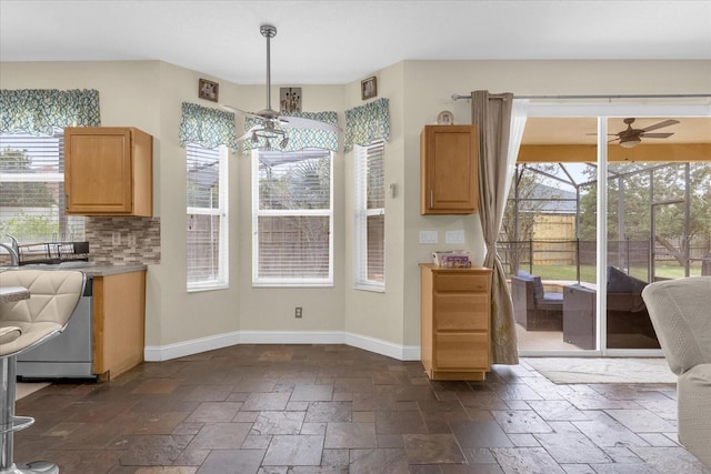 dining space featuring a wealth of natural light and ceiling fan