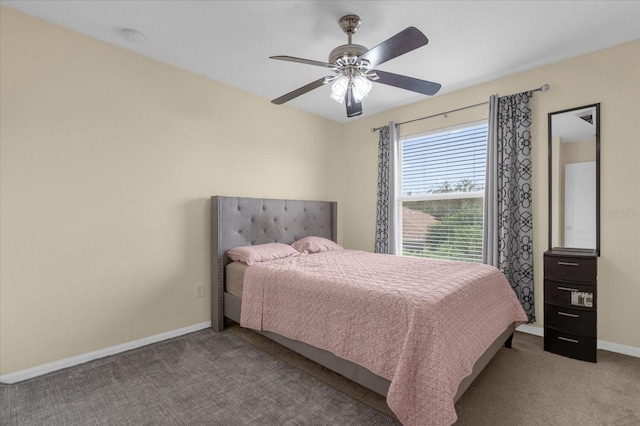 bedroom with ceiling fan and light carpet