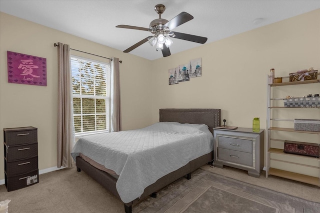 bedroom with ceiling fan and carpet floors