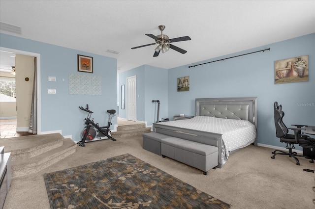 carpeted bedroom with ceiling fan and a closet