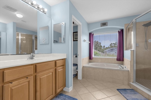 full bathroom featuring shower with separate bathtub, vanity, toilet, and tile patterned floors