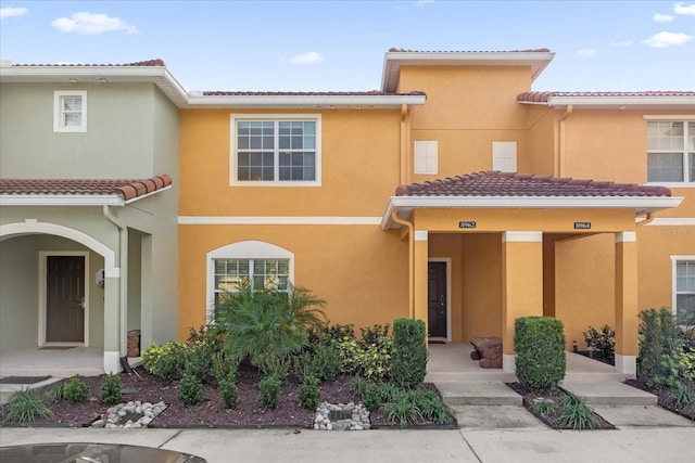 8962 Cuban Palm Rd, Kissimmee, FL 34747 - view of property featuring stucco siding and a tile roof