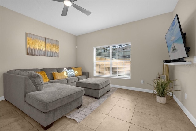 living room with ceiling fan and light tile patterned flooring