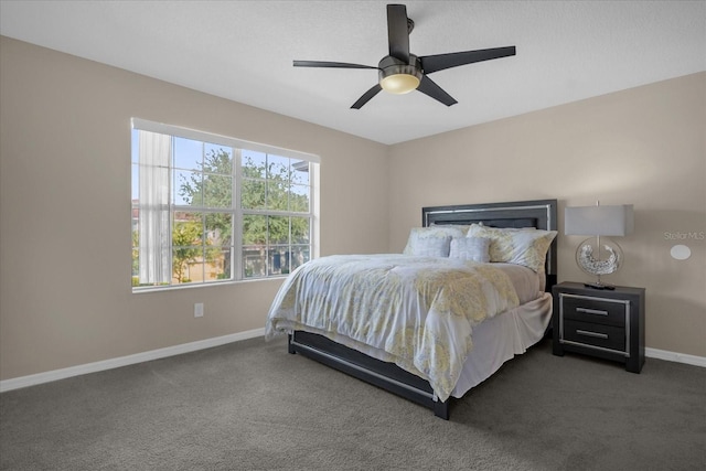 bedroom featuring dark carpet and ceiling fan