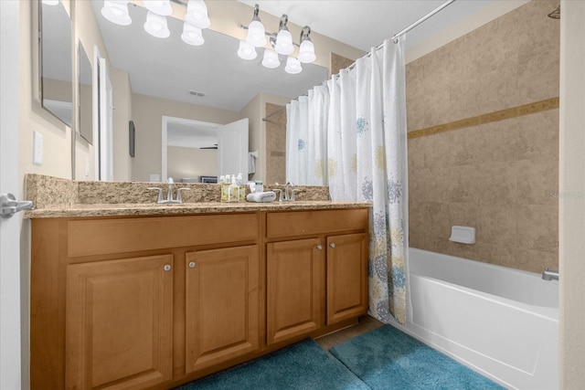 bathroom with vanity and shower / tub combo with curtain