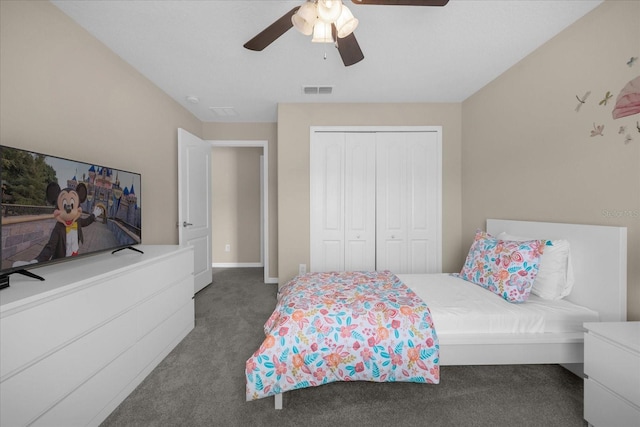 carpeted bedroom with ceiling fan and a closet