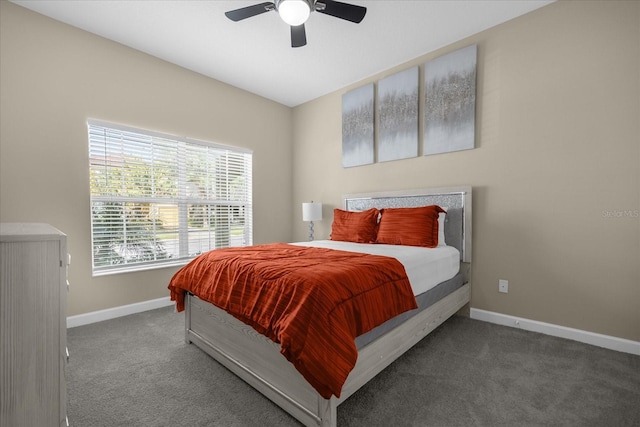 bedroom featuring ceiling fan and dark colored carpet