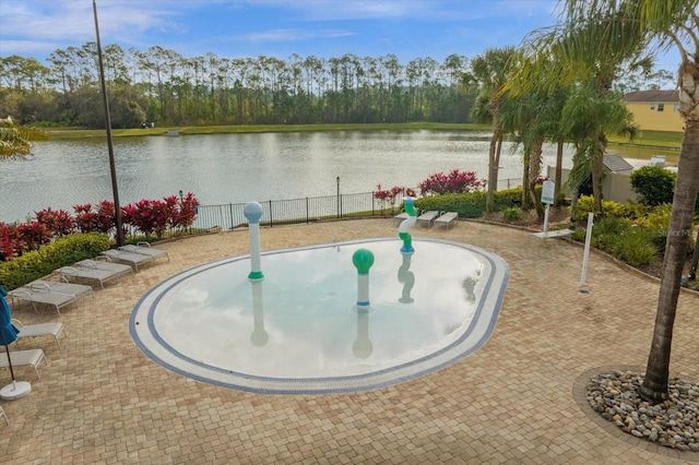 view of pool featuring a water view