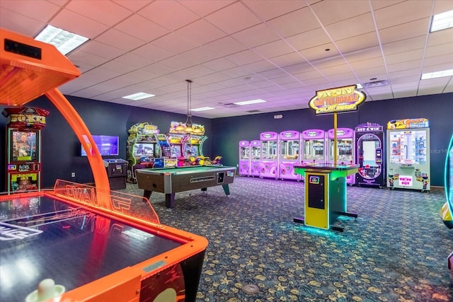 game room with dark colored carpet