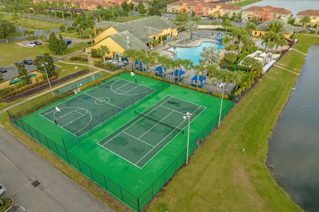 view of sport court featuring a water view