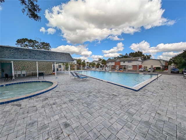 view of swimming pool with a patio