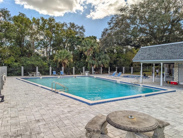 view of swimming pool with a patio