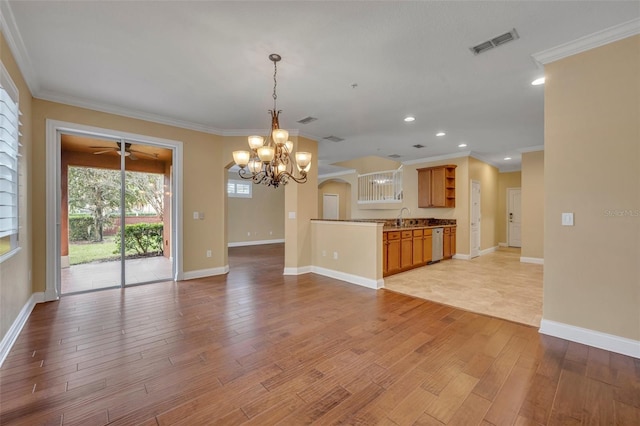 kitchen with light hardwood / wood-style floors, sink, decorative light fixtures, crown molding, and dishwasher