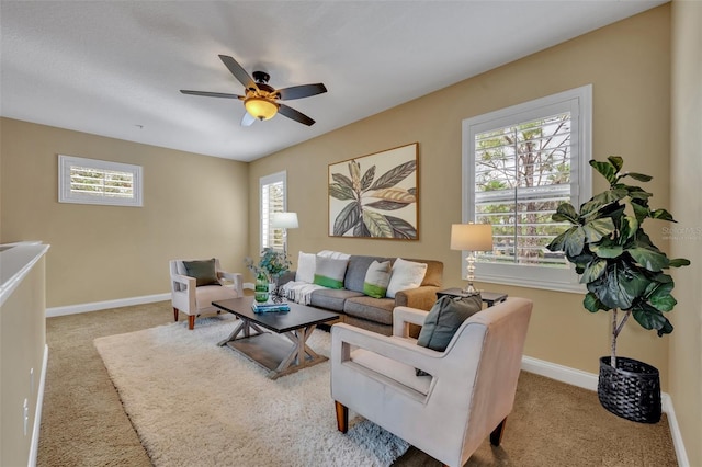 carpeted living room featuring ceiling fan