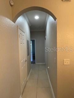 corridor featuring light tile patterned flooring