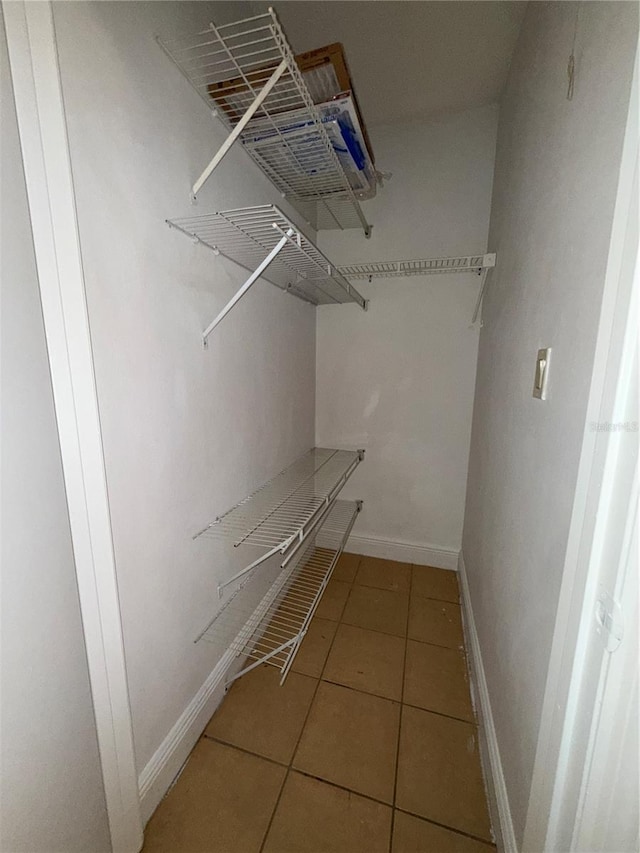 spacious closet featuring tile patterned floors