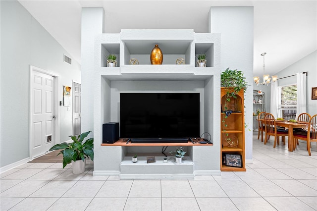 living room with a chandelier, light tile patterned floors, and high vaulted ceiling