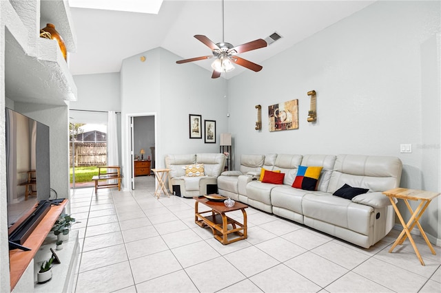 tiled living room with high vaulted ceiling and ceiling fan