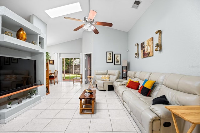 tiled living room with ceiling fan and high vaulted ceiling