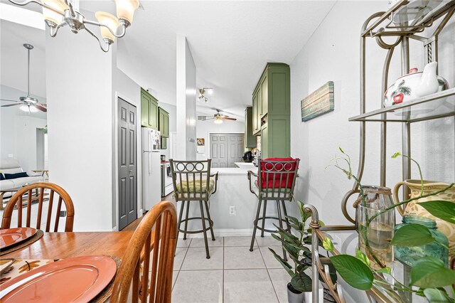 dining area featuring light tile patterned floors and ceiling fan