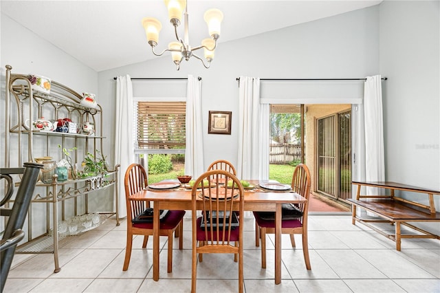 dining area featuring a wealth of natural light, light tile patterned flooring, vaulted ceiling, and an inviting chandelier