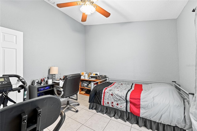 tiled bedroom with ceiling fan