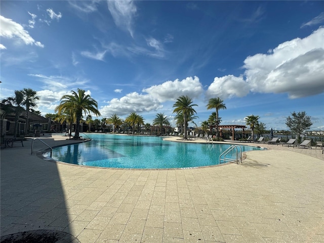 view of swimming pool featuring a patio area