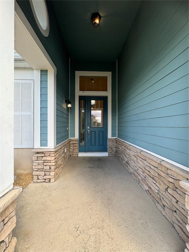 doorway to property with a porch