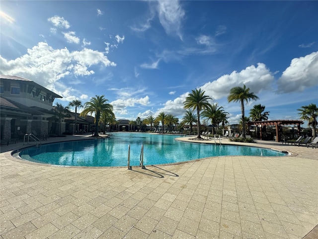 view of swimming pool with a patio