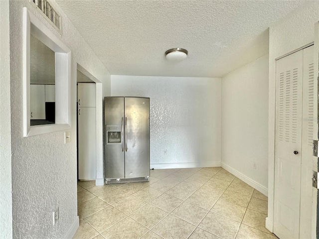 interior space featuring a textured ceiling