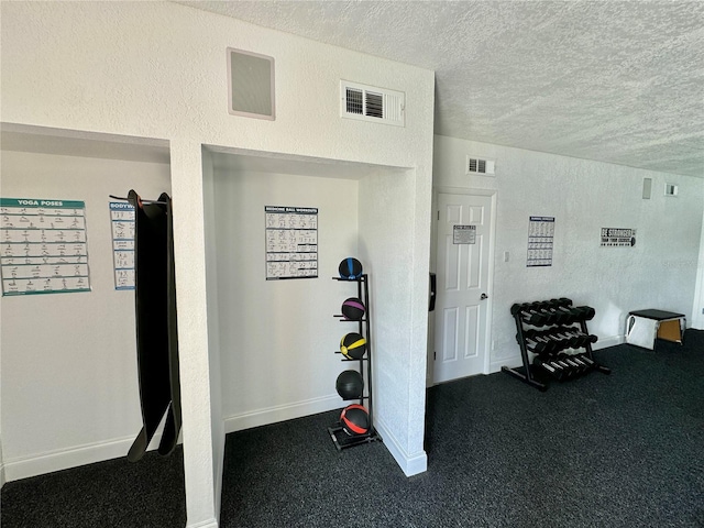 exercise area with a textured ceiling