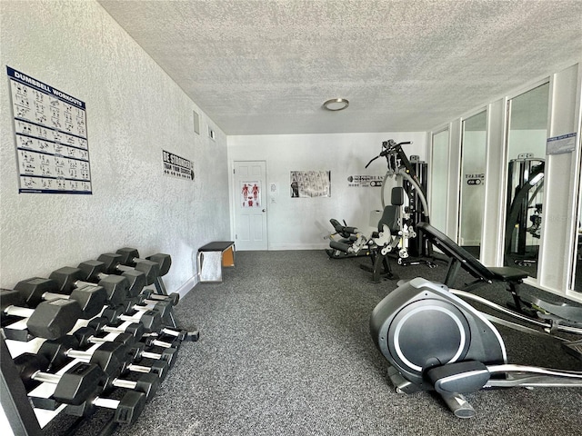 gym with a textured ceiling