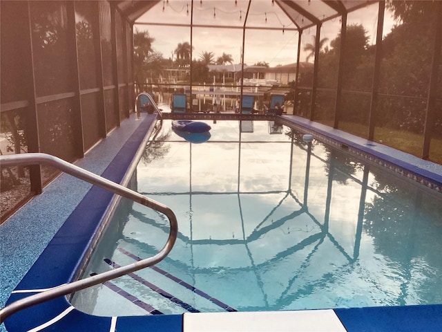 view of pool at dusk