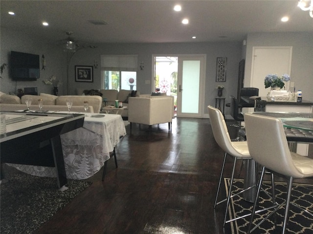 dining space with dark hardwood / wood-style floors