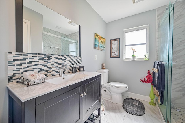 bathroom featuring tasteful backsplash, tile patterned floors, toilet, vanity, and a shower with shower door