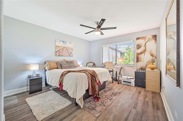 bedroom featuring hardwood / wood-style flooring and ceiling fan