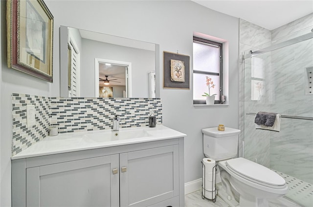 bathroom featuring decorative backsplash, walk in shower, vanity, ceiling fan, and toilet