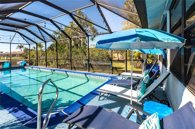 view of pool with a lanai