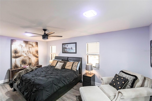 bedroom featuring wood-type flooring and ceiling fan