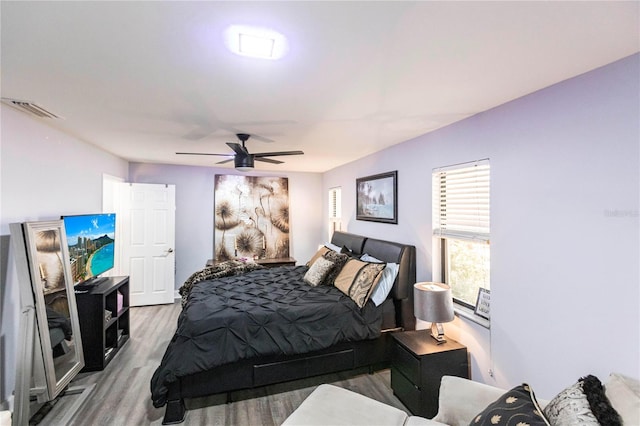 bedroom featuring hardwood / wood-style floors and ceiling fan