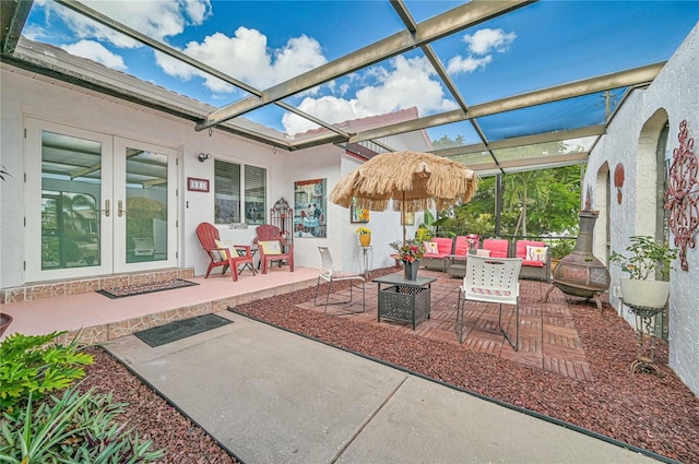 view of patio with french doors, outdoor lounge area, and a pergola