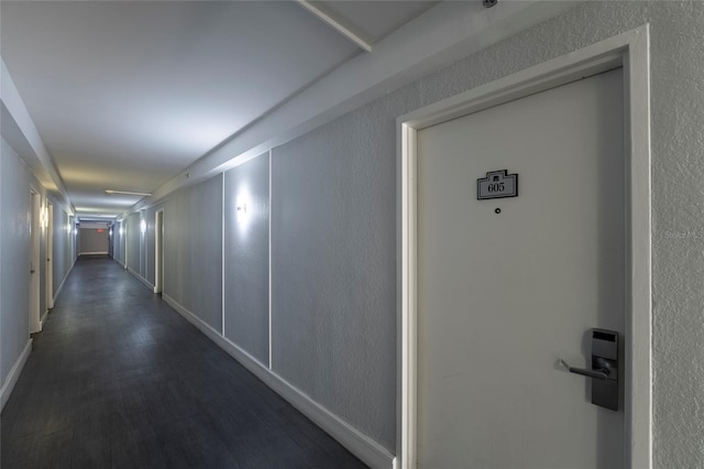 hallway featuring dark hardwood / wood-style flooring