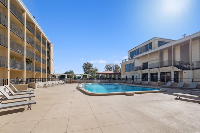 view of swimming pool with a patio area