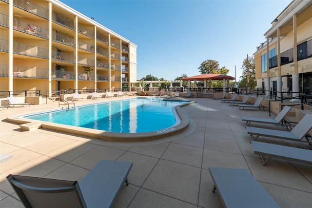 view of swimming pool with a patio