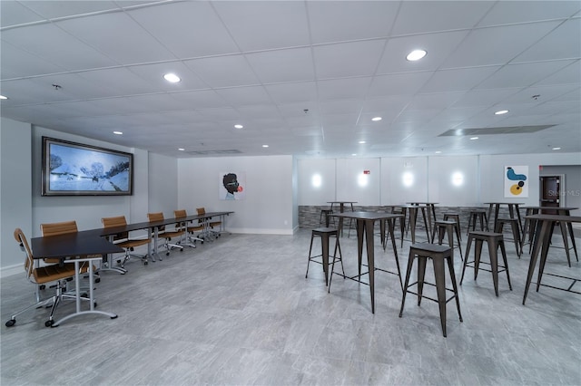 dining space featuring a paneled ceiling