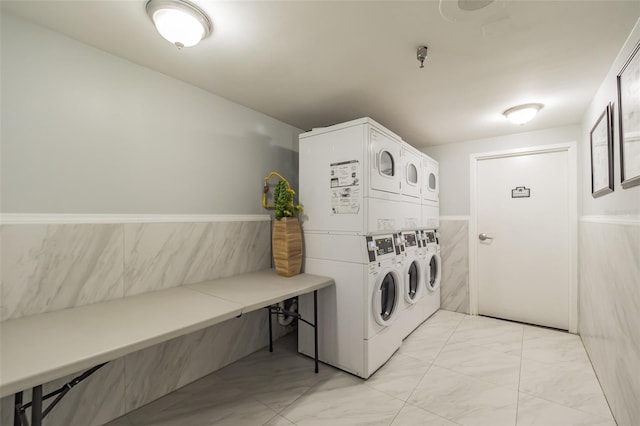 laundry room featuring stacked washer / dryer