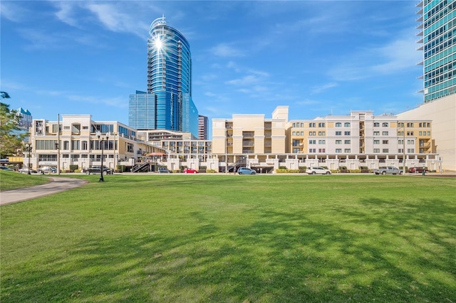 view of property's community with a lawn