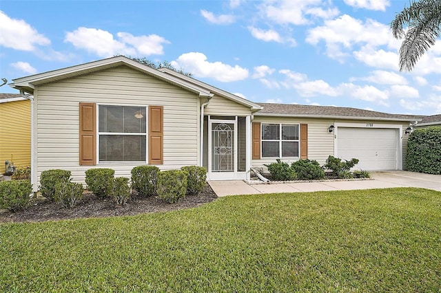 view of front facade with a garage and a front yard